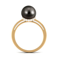 Tahitian pearl solitaire engagement ring with diamond surprise halo, featuring a rose gold band and intricate design details.