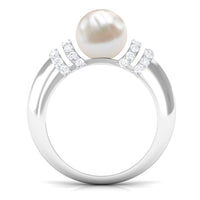 Rosec Jewels 7.48 Carat freshwater pearl solitaire engagement ring with a diamond, showcasing a elegant pearl centerpiece and silver band.