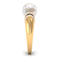 Freshwater pearl solitaire engagement ring with diamond accents by Rosec Jewels, showcasing a 7.48-carat pearl on a delicate band