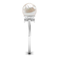 Natural 7.4 carat freshwater pearl solitaire engagement ring with diamond, featuring a rose gold band by Rosec Jewels.