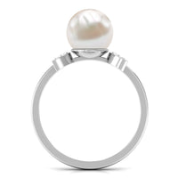 Natural 7.4 carat freshwater pearl solitaire engagement ring with diamond accents by Rosec Jewels, showcasing an elegant ring design.