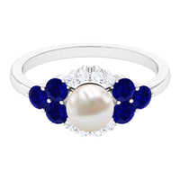 Elegant Rosec Jewels 2 Carat freshwater pearl and blue sapphire engagement ring with diamond accents, showcasing intricate design and craftsmanship.