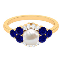 Two-carat freshwater pearl and blue sapphire engagement ring with diamond accents, showcasing elegant jewelry design by Rosec Jewels.