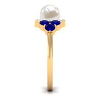 Rosec Jewels 2 Carat freshwater pearl and blue sapphire engagement ring with diamond, showcasing elegant design and sparkling gemstones.