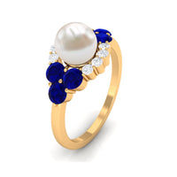 Rosec Jewels 2 Carat freshwater pearl and blue sapphire engagement ring with diamond, showcasing elegant jewelry craftsmanship.