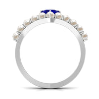 Blue sapphire and freshwater pearl chevron ring from Rosec Jewels, featuring a 2 ct solitaire design with elegant craftsmanship.