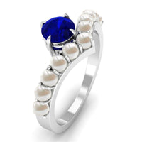 Rosec Jewels 2 CT Solitaire Blue Sapphire and Freshwater Pearl Chevron Ring featuring a blue sapphire centerpiece and pearl accents.
