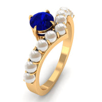 Silver solitaire blue sapphire and freshwater pearl chevron ring by Rosec Jewels with 2-carat blue sapphire and pearl accents.