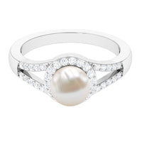 Rosec Jewels freshwater pearl engagement ring with split shank and diamond halo, showcasing elegant jewelry design.