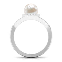 Rosec Jewels freshwater pearl engagement ring with split shank design and diamond halo, showcasing elegant craftsmanship.