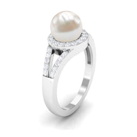 Rosec Jewels freshwater pearl engagement ring with split shank and diamond halo, showcasing elegant design and sparkling accents.