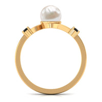 Two-carat freshwater pearl bypass engagement ring with black diamond accents by Rosec Jewels, featuring elegant pearl and dark gemstone details.