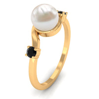 Freshwater pearl bypass engagement ring with black diamond from Rosec Jewels, featuring elegant 2-carat pearl and dark gemstone accents.