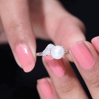 Cultured 3 Carat freshwater pearl solitaire engagement ring with diamond, featuring a yellow gold band from Rosec Jewels.