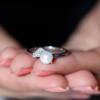 Cultured 3 Carat freshwater pearl solitaire engagement ring with diamond setting by Rosec Jewels on a white background