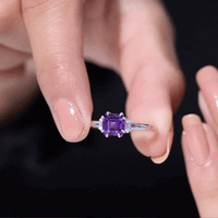 Natural 1.3 carat amethyst Asscher cut engagement ring with diamond accents, showcasing a yellow gold band and intricate detailing.