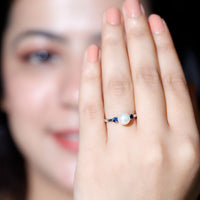 Cultured freshwater pearl and blue sapphire engagement ring by Rosec Jewels, featuring a delicate band and elegant gemstone accents.
