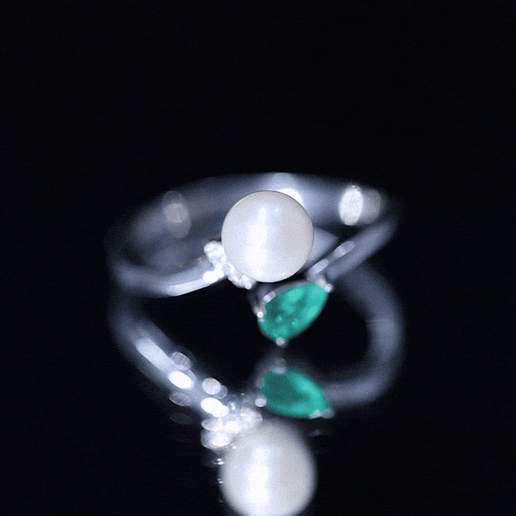 Cultured freshwater pearl and emerald Toi Et Moi promise ring by Rosec Jewels, featuring a pearl and emerald set in a delicate ring.