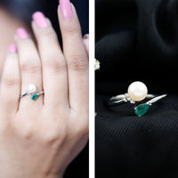 Cultured freshwater pearl and emerald toi et moi promise ring by Rosec Jewels, featuring elegant pearl and green gemstone accents.