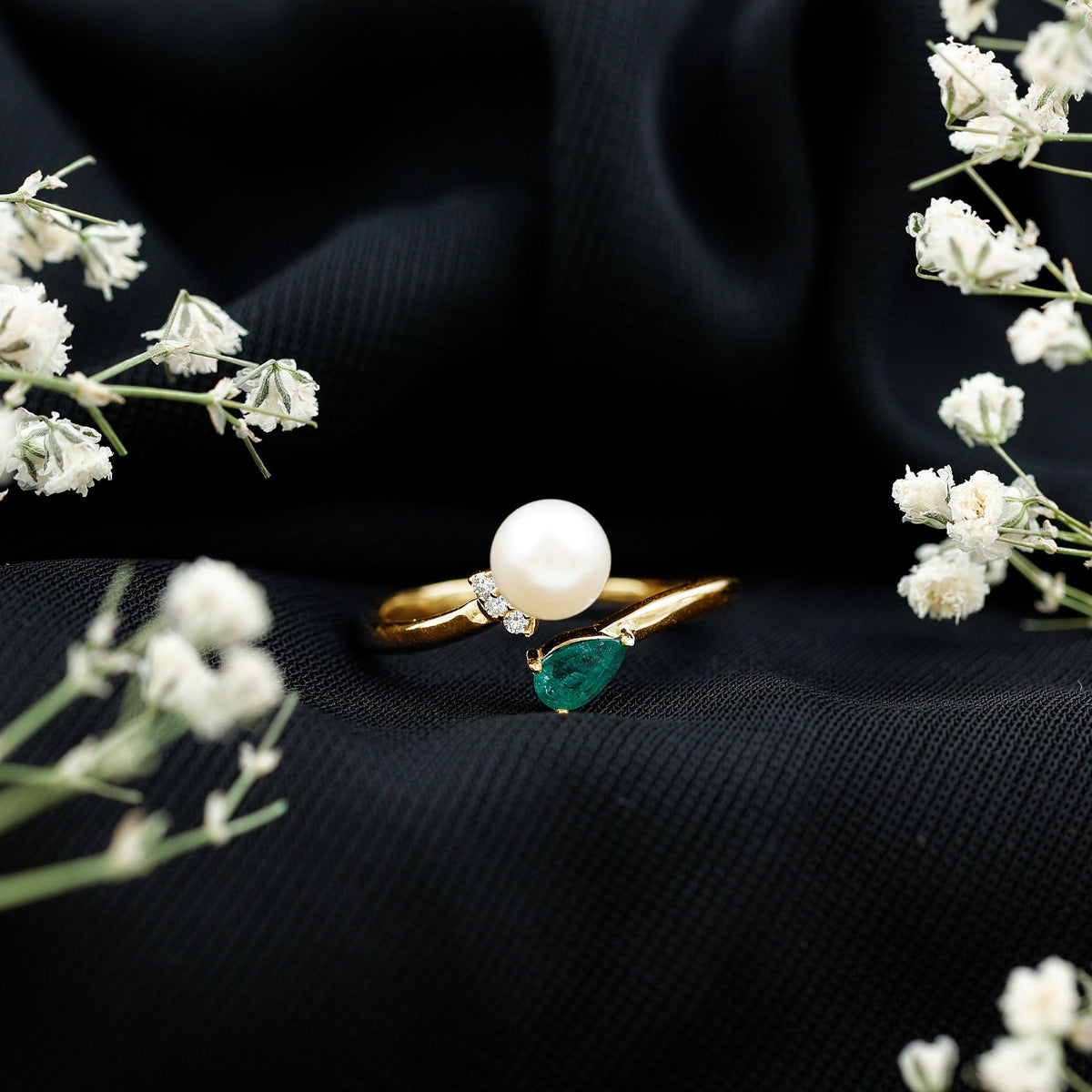 Cultured freshwater pearl and emerald toi et moi promise ring from Rosec Jewels, featuring two gemstones set in elegant silver band