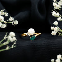 Cultured freshwater pearl and emerald toi et moi promise ring from Rosec Jewels, featuring two gemstones set in elegant silver band