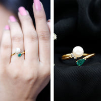 Cultured freshwater pearl and emerald Toi Et Moi promise ring by Rosec Jewels, featuring a pearl and emerald set in a delicate ring.