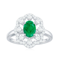 Rosec Jewels 0.7 carat oval emerald engagement ring with diamond accent, featuring a sleek gold band and elegant design.