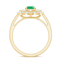 Rosec Jewels 0.7 Carat oval emerald engagement ring with diamond accent, featuring a sleek gold band and intricate design.