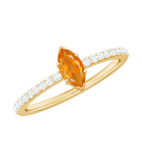 Rosec Jewels 1/2 Ct fire opal marquise engagement ring with diamond accent, featuring a detailed gold band and elegant design.