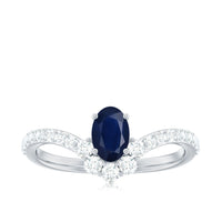 Oval cut blue sapphire and diamond chevron ring by Rosec Jewels featuring 1.25 CT gemstones and elegant gold band.