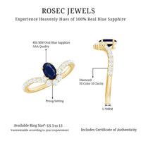 Oval cut blue sapphire and diamond chevron ring by Rosec Jewels, featuring a 1.25 CT gemstone design with intricate metalwork.