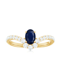 Oval cut blue sapphire and diamond Chevron ring by Rosec Jewels, featuring a 1.25 CT center stone and elegant band design.