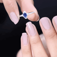 Oval blue sapphire engagement ring with diamond accents by Rosec Jewels, featuring a 0.6 carat sapphire centerpiece.