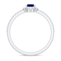 Oval blue sapphire engagement ring with diamond accents by Rosec Jewels, showcasing the intricate design and sparkling gemstones.