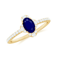 Oval blue sapphire engagement ring with diamond accents by Rosec Jewels, showcasing a 0.6 carat sapphire and intricate band details.