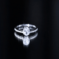 Yellow gold 1.2 carat oval cut zircon solitaire engagement ring with side stones from Rosec Jewels, showcasing a elegant ring design.