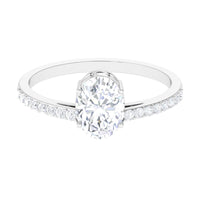 Oval cut zircon engagement ring with side stones from Rosec Jewels, showcasing a 1.2 carat solitaire design in silver-tone metal.