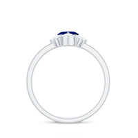 Heart-shaped blue sapphire promise ring with diamond accents by Rosec Jewels, showcasing a 0.6 carat gemstone in a elegant ring setting.
