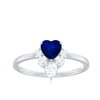 Heart-shaped blue sapphire promise ring with diamond accents from Rosec Jewels, showcasing the detailed gemstone setting.