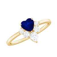 Heart-shaped blue sapphire promise ring with diamond accent, crafted by Rosec Jewels, featuring a 0.6 carat gemstone centerpiece.