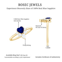 Heart-shaped blue sapphire promise ring with diamond accents, crafted by Rosec Jewels, featuring a 0.6 carat gemstone and elegant design.