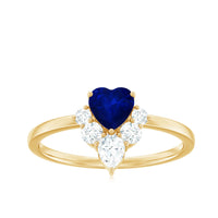 Heart-shaped blue sapphire promise ring with diamond accents, crafted by Rosec Jewels, showcasing the elegant design and fine details.