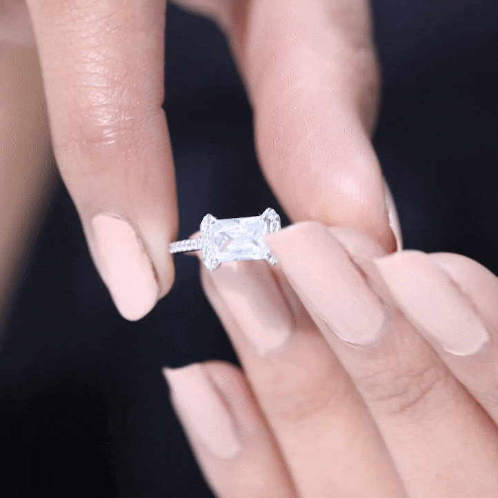 Yellow gold cubic zirconia emerald cut east-west engagement ring with 1.7 carats, featuring a Rosec Jewels design.