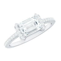 Elegant 1.7 carat cubic zirconia emerald cut east-west engagement ring by Rosec Jewels with a sleek silver band.