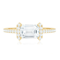 Elegant 1.7 carat cubic zirconia emerald cut east-west engagement ring by Rosec Jewels with a sleek band and sparkling stone.