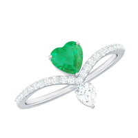 Elegant emerald heart engagement ring with diamond accent by Rosec Jewels, showcasing a stunning design and sparkling gemstones.