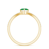 Rosec Jewels emerald heart engagement ring with diamond, featuring a detailed design and sparkling gemstone centerpiece.