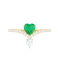 Rosec Jewels designer emerald heart engagement ring with diamond, showcasing a stunning green gemstone and intricate band design.