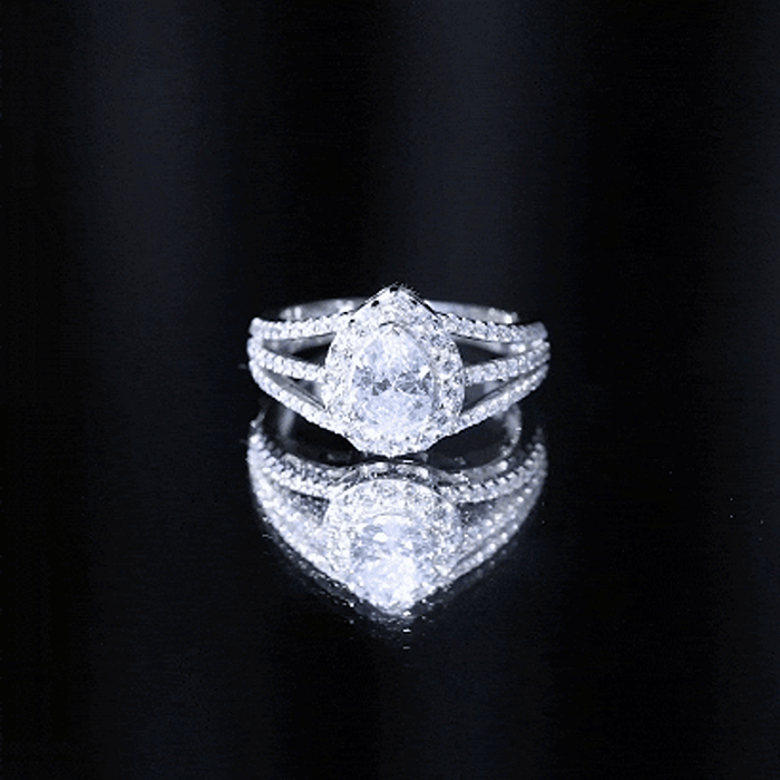 Pear-shaped cubic zirconia engagement ring with split shank design, crafted by Rosec Jewels for women.