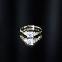Yellow gold crossover engagement ring with 1.25 carat princess cut cubic zirconia from Rosec Jewels, showcasing sparkling gemstone and elegant design.